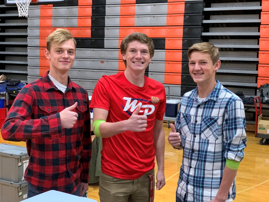 three boys smiling